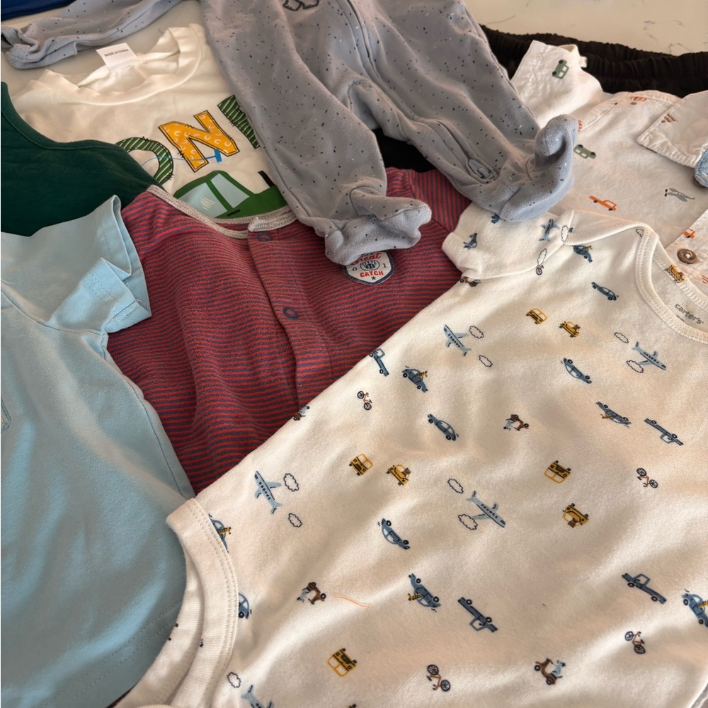 Assorted Baby Onesies,shirts,jackets and pajamas.